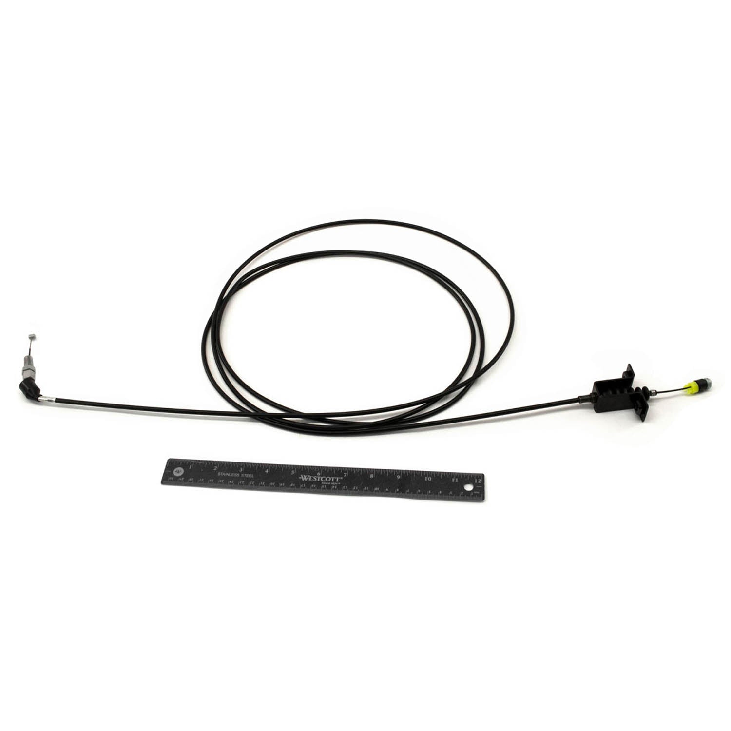 Black flexible throttle cable with metal connectors on both ends and a plastic mounting bracket, shown next to a ruler for.