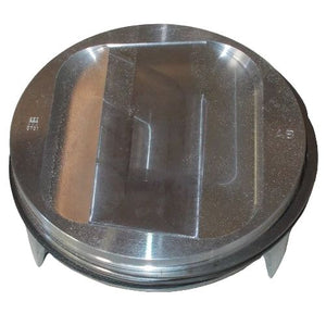 A close-up of the Piston, Assembly (Incl. Piston, Rings, Clips, Pin) by Polaris shows its flat, slightly indented top, edge grooves, and reflective finish—perfect for Victory motorcycle enthusiasts seeking quality OEM replacement parts.