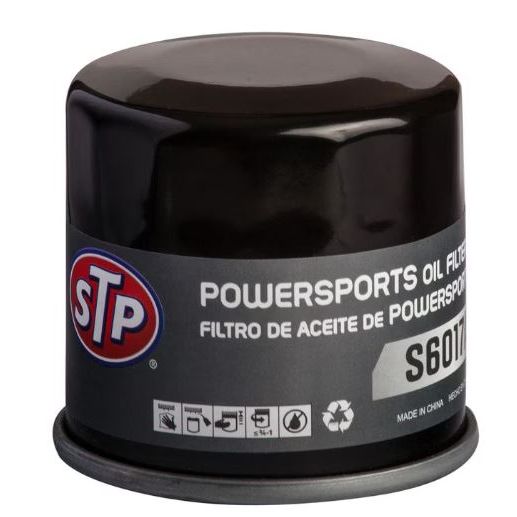 A black Oil Filter by STP with a gray label showing product details and model S6017 is displayed against a white background, featuring advanced filtration technology for superior engine protection.