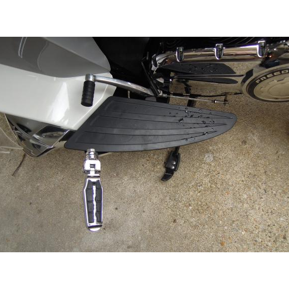 Close-up of the Victory Highway Peg Floorboard Mounts Black by Witchdoctors on concrete, highlighting detailed metal and rubber—perfect for riders seeking premium Victory Cross Country accessories.